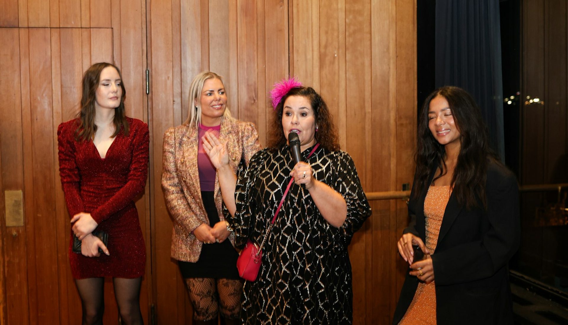 Women speaking at a live event